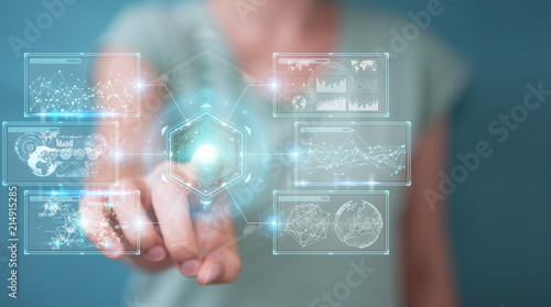 Businesswoman using digital screens interface with holograms datas 3D rendering