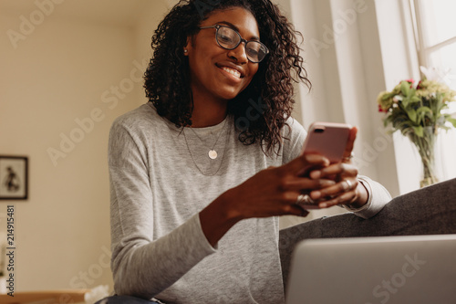 Businesswoman working from home on laptop