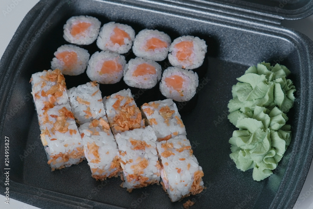 Set of rolls in plastic packaging on the kitchen table. Set of rolls in plastic packaging on the kitchen table.