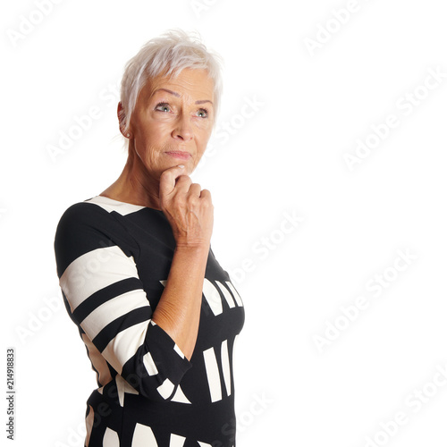 contemplative older woman looking up. with copy space photo