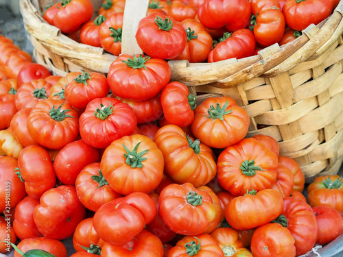 organic fresh tomatoes sold in a basket