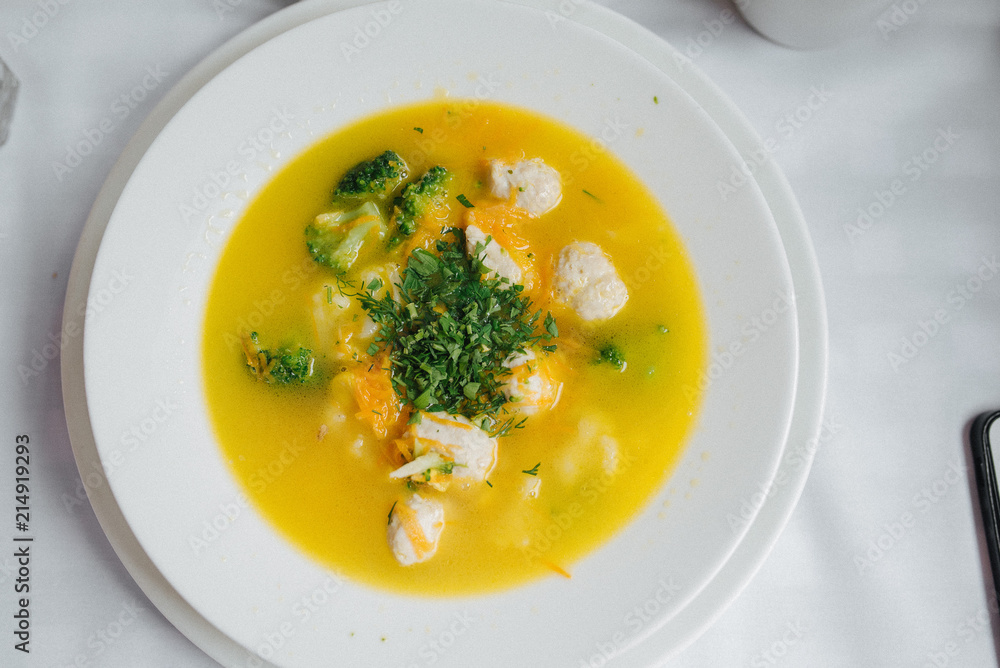 Dietary soup. Bowl plate of soup with vegetables, meatballs made of turkey and chicken, top view Dietary soup. Bowl plate of soup with vegetables, meatballs made of turkey and chicken, top view