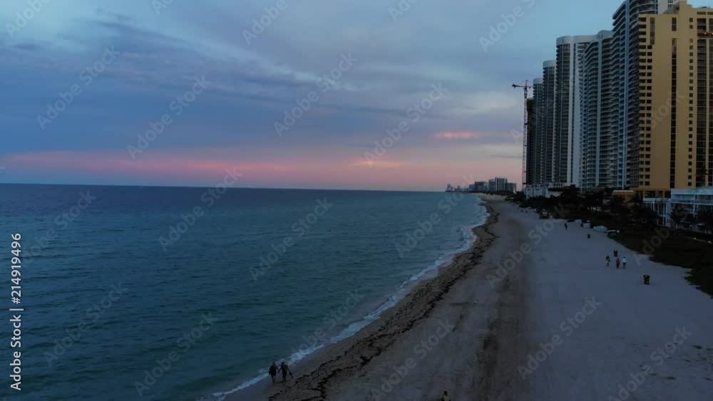 Cinematic aerial view of Sunny Isles beach at sunset in Miami, Florida, USA Cinematic aerial view of Sunny Isles beach at sunset in Miami, Florida, USA