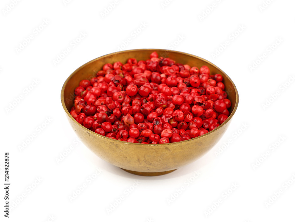 One bronze metal bowl full of pink peppercorns One bronze metal bowl full of pink peppercorns