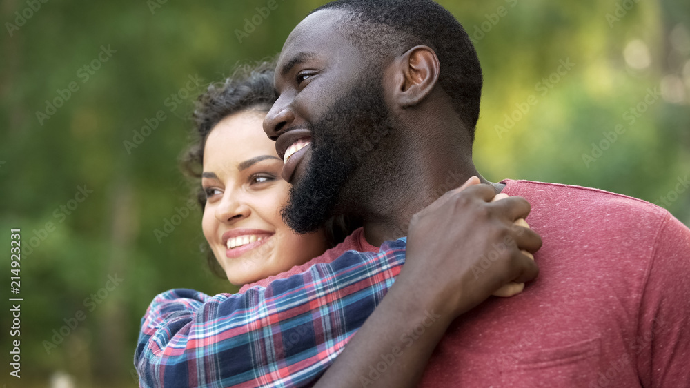 © motortion - Happy multiethnic couple, celebrate diversity, no to racism and discrimination