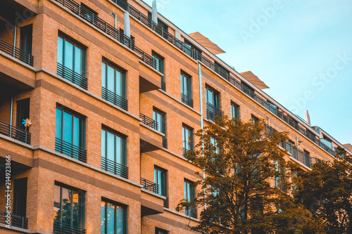 typical orange brick apartment house with square windows