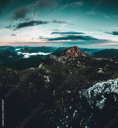 Blick vom Gipfel des Hochstaufen auf die Berchtesgadener Alplen bei Sonnenuntergang photo