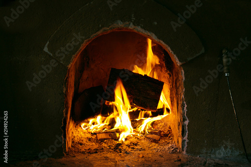 Fireplace. Burning firewood.
