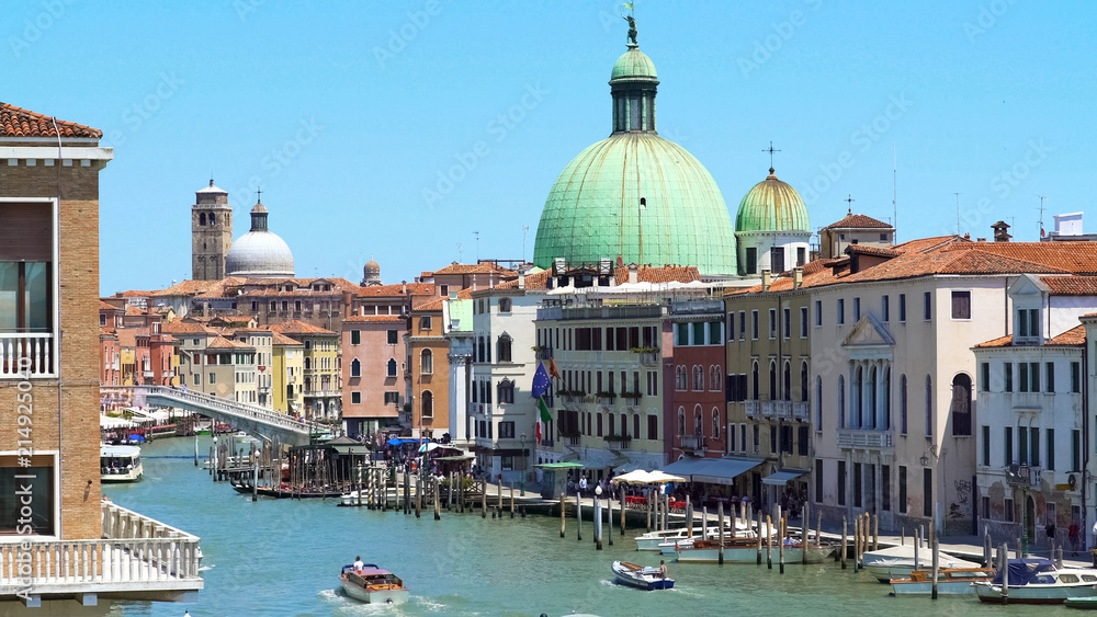 Ships sailing Grand Canal in Venice, view of San Simeone Piccolo church, travel