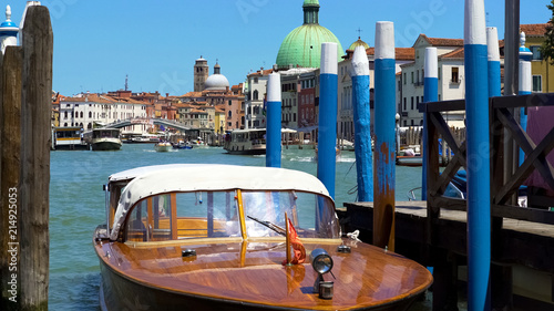 Photos Motorboat tied up at shore, water transportation on Grand Canal, marine tour