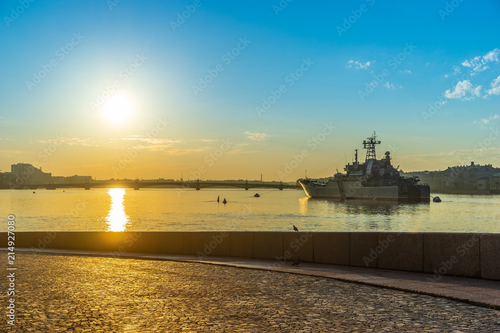 Saint Petersburg. Russia. Morning in Petersburg. Peter-Pavel's Fortress. The Neva River in St. Petersburg. A warship in the background of the city. Descent to the Neva River. Vasilievsky Island.