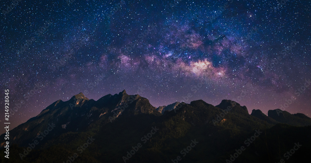 Night view of nature mountain with universe space of milky way galaxy and stars on sky