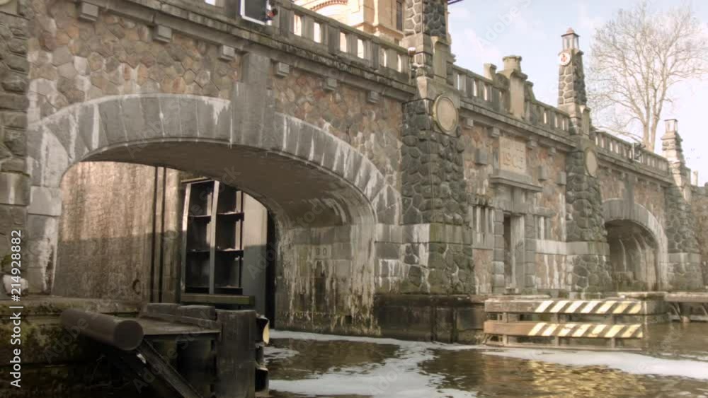 Old cobble stone bridge with a peaceful river running through. Old cobble stone bridge with a peaceful river running through.