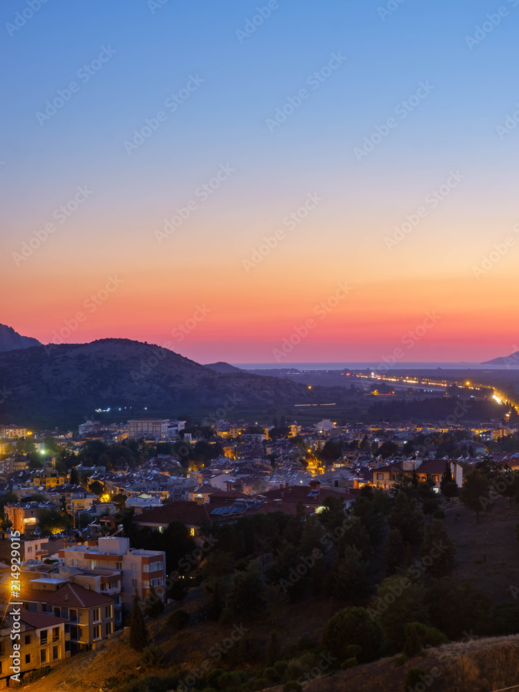 Selcuk, Turkey. View of the city and the mountains at sunset.