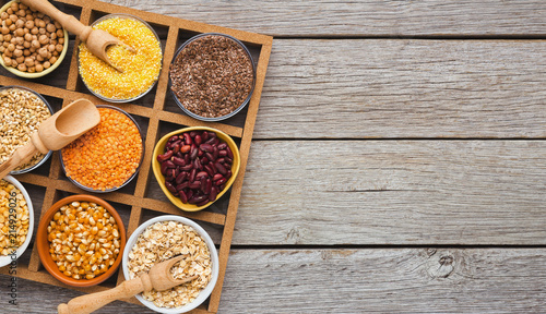Cereals and legumes assortment on wooden table