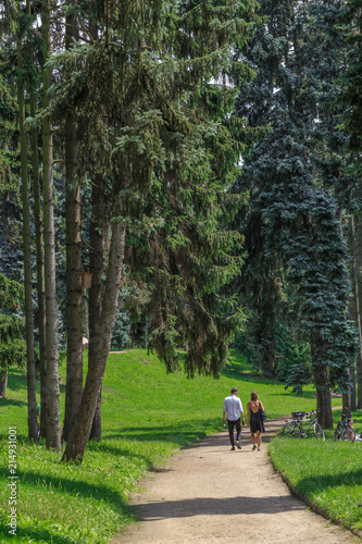 Fototapeta Naklejka Na Ścianę i Meble -  A walking people in Skaryszewski Park in Warsaw, Praga Poludnie district