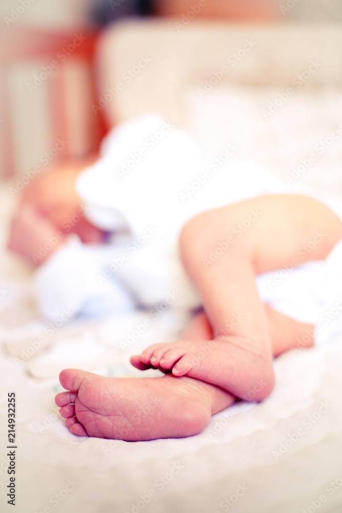 Newborn baby boy sleeping on burlap blanket Newborn baby boy sleeping on burlap blanket