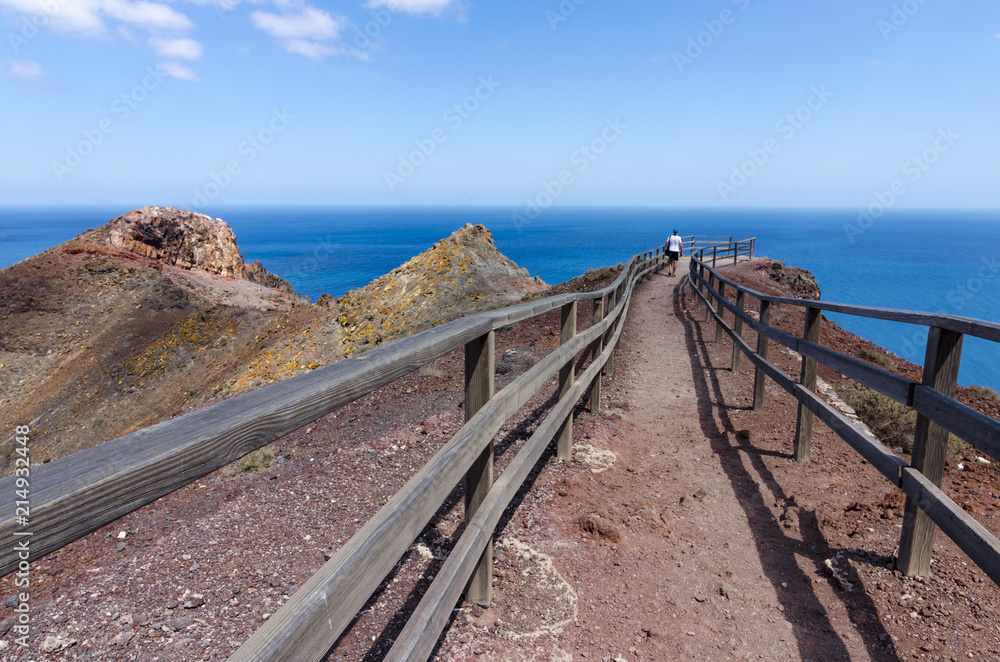 Perspective: a tourist admires the view to the sea and the mountains