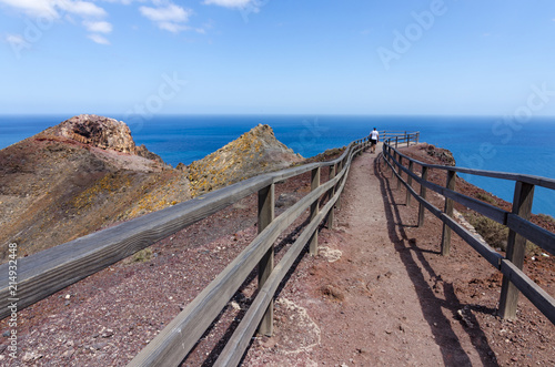 Perspective  a tourist admires the view to the sea and the mountains