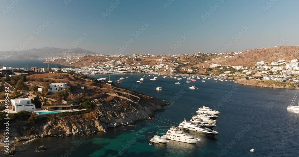 Aerial view of a beach with blue sea and its green and lush vegetation along the coast with luxury boat. Concept of: holiday, travel, nature. Aerial view of a beach with blue sea and its green and lush vegetation along the coast with luxury boat. Concept of: holiday, travel, nature.