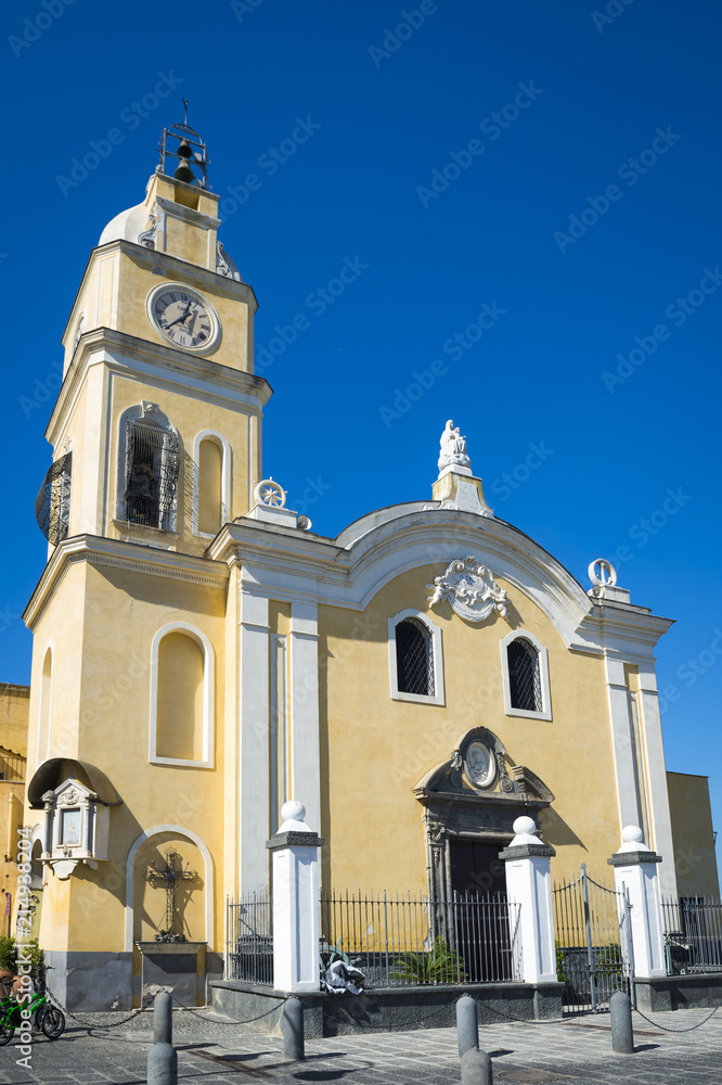 Beautiful baroque style catholic church stands next to Procida marina