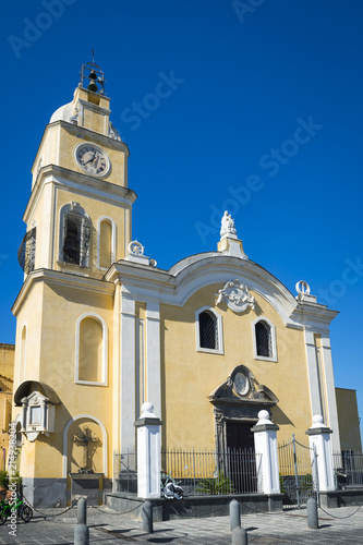 Beautiful baroque style catholic church stands next to Procida marina