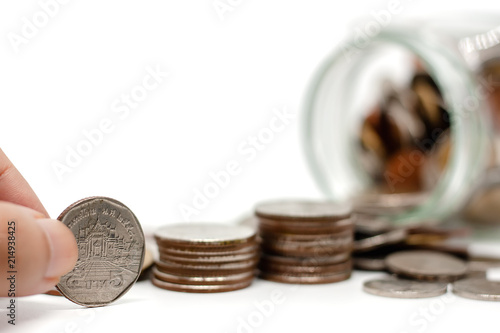 Hand saving a coin on the s...