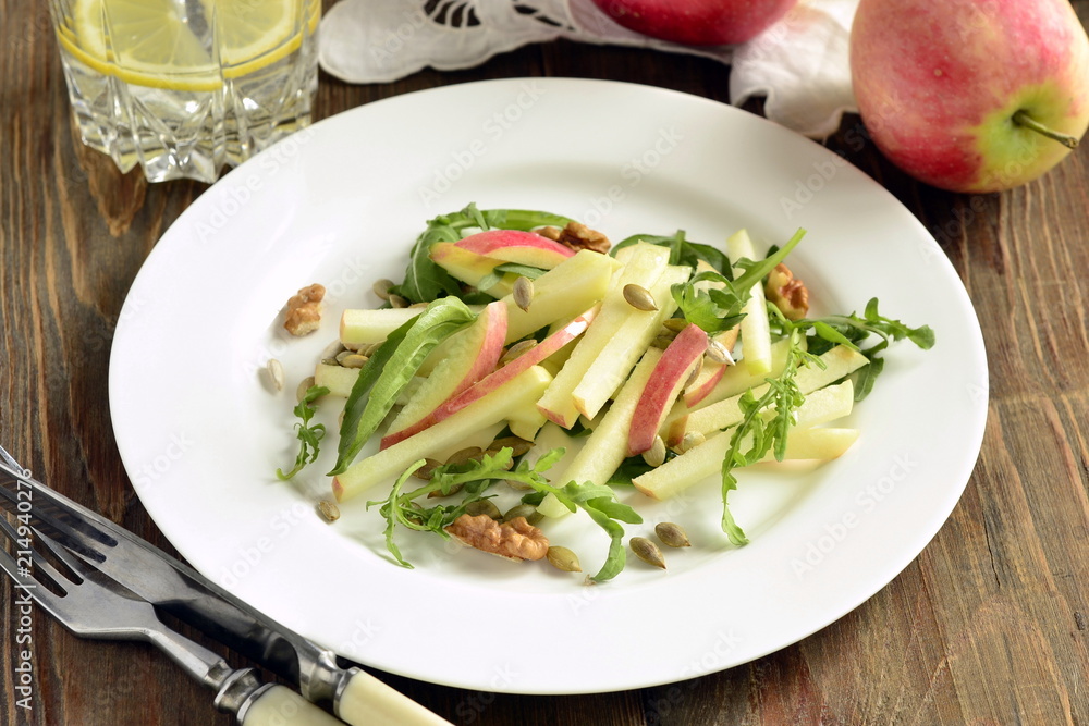 Apple salad with walnuts, pumpkin seeds and arugula Apple salad with walnuts, pumpkin seeds and arugula