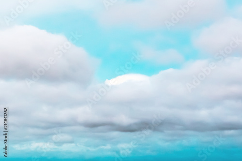 Colorful cloudy bright blue sky texture background