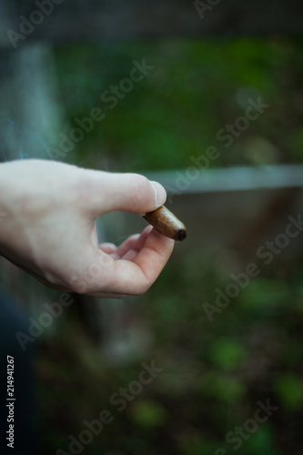Young handsome stylish man smoking cigar © Евгений Округин