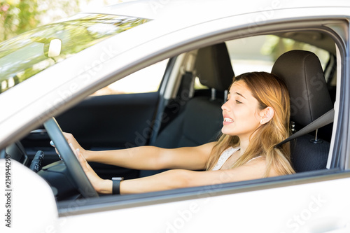 Annoyed female driver honking in traffic jam