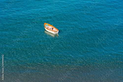 Картината върху платно A lonesome boat. Top view of a Fisherboat