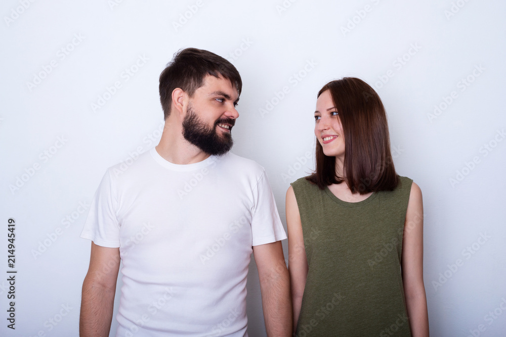 Young couple smiling and looks each to other Young couple smiling and looks each to other