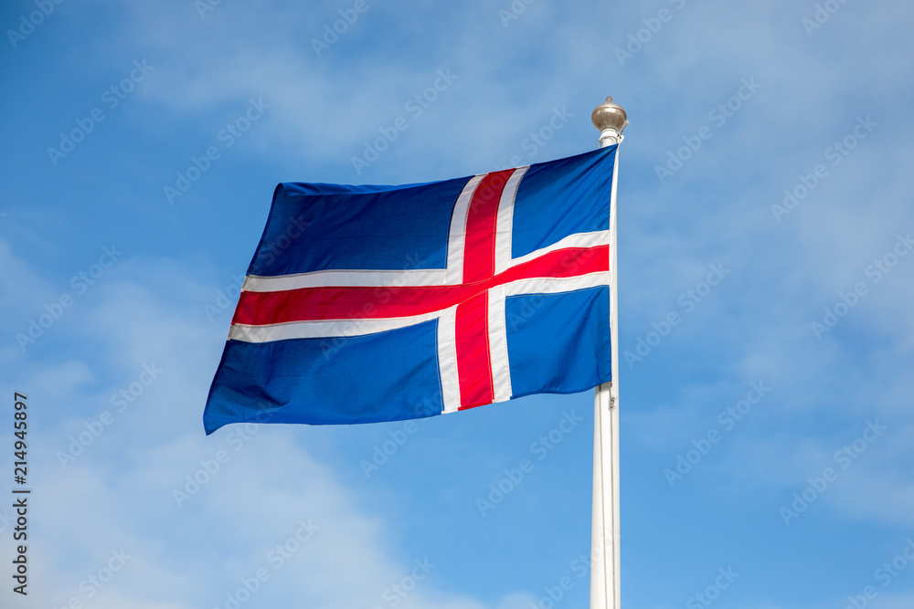 Flag of Iceland waving on the wind with blue sky background Flag of Iceland waving on the wind with blue sky background