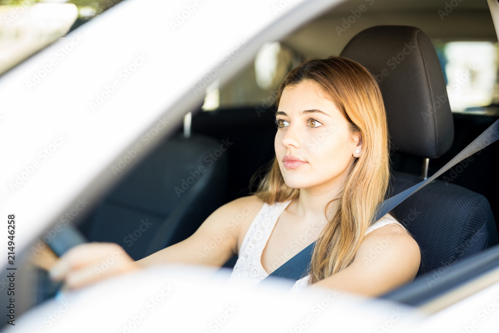 Good looking woman driving car