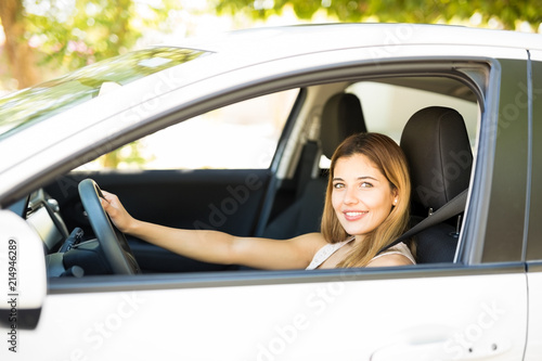 Gorgeous woman driving car