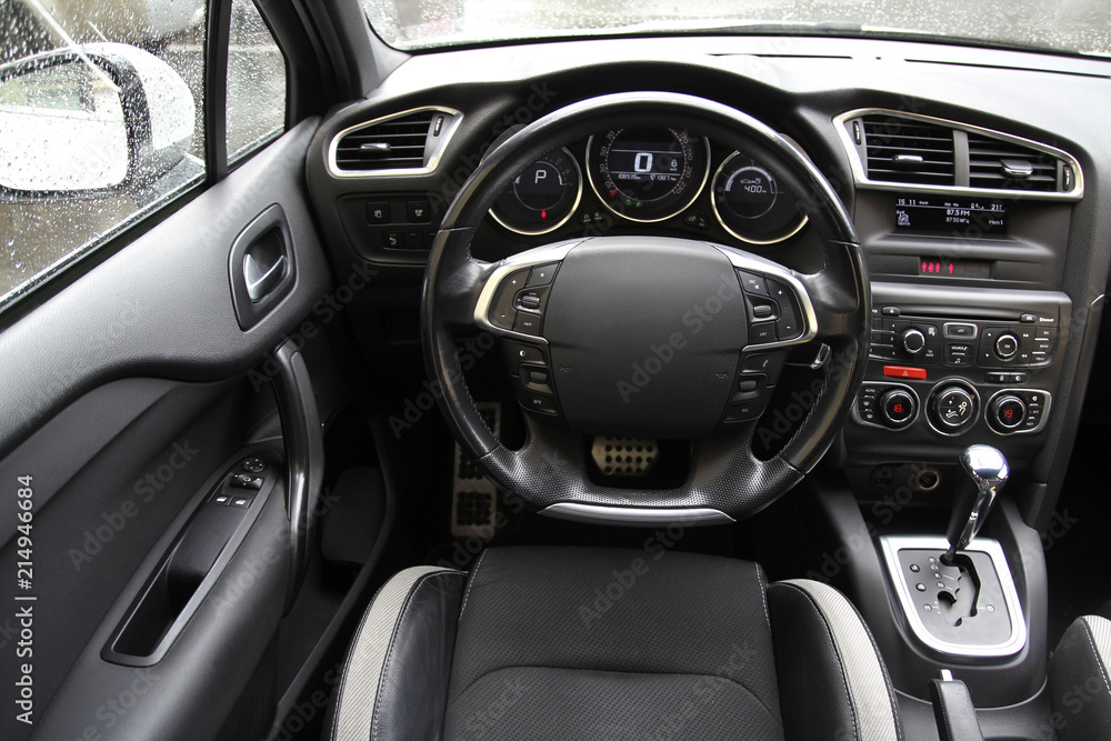 Steering wheel on the car dashboard and the driver's seat Steering wheel on the car dashboard and the driver's seat