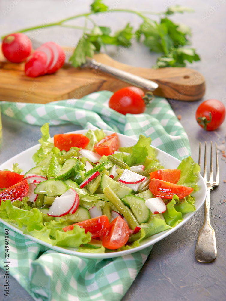 Light summer salad with tomatoes and radishes Light summer salad with tomatoes and radishes