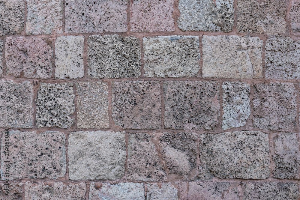 Old stone brick wall of St.Peter's church in Riga, Latvia Old stone brick wall of St.Peter's church in Riga, Latvia