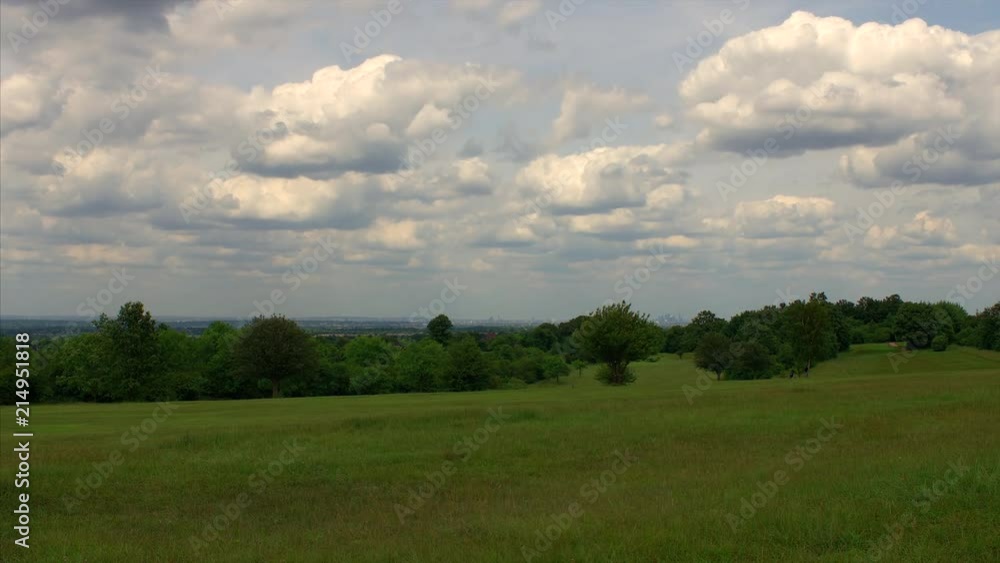 A time-lapse in the beautiful English countryside. With beautiful fluffy clouds and a view of London on the horizon. A time-lapse in the beautiful English countryside. With beautiful fluffy clouds and a view of London on the horizon.