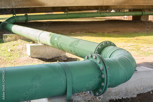 Straight line of potable water pipe on sunrise.