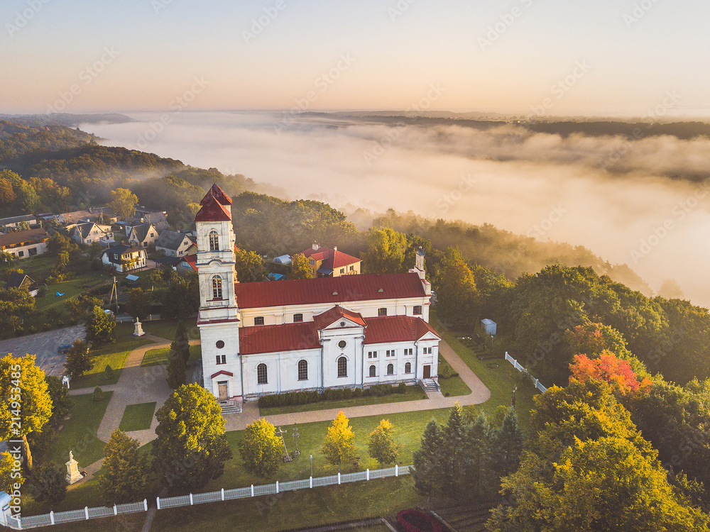 Aerial view of church in foggy morning