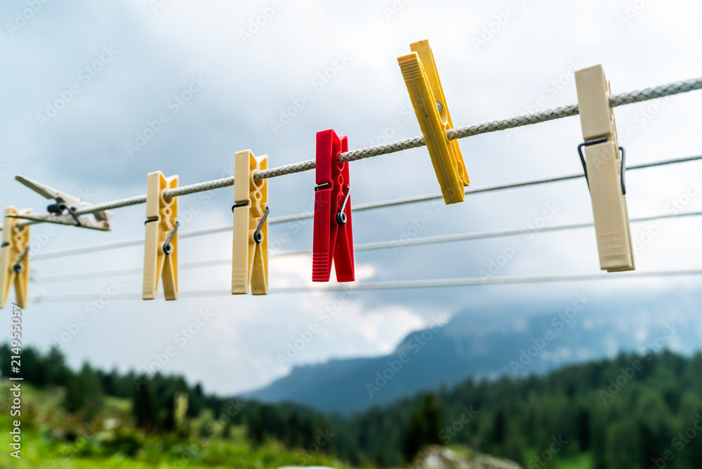 Clothes pins on a clothes line rope. clothespins hanging hook. Clothes pins  lined up on a