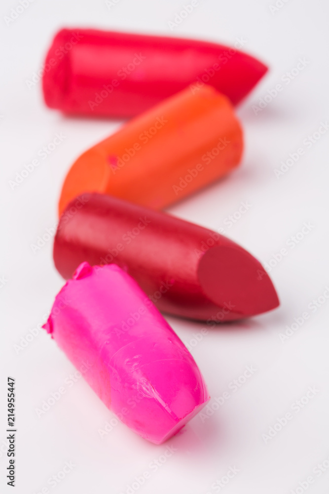 Lipstick slices collection. Close up of four slices lipstick on white background Lipstick slices collection. Close up of four slices lipstick on white background