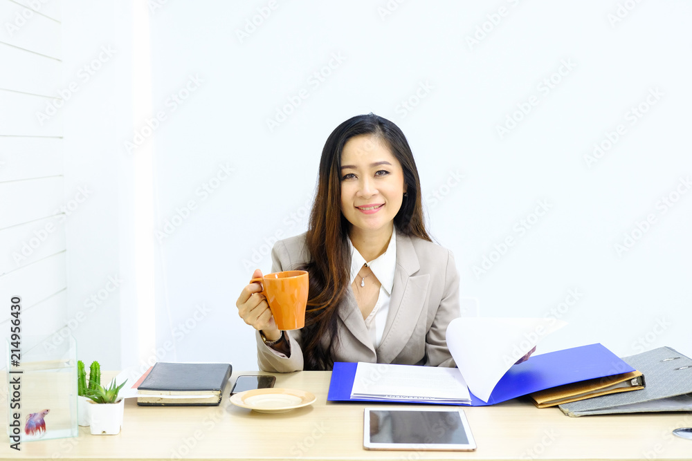 Businesswoman in office with beautiful fish in a dozen glasses. Businesswoman in office with beautiful fish in a dozen glasses.