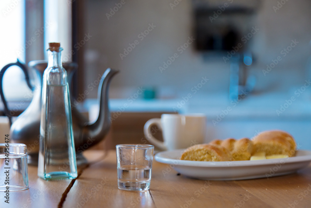 Traditional Crete breakfast, bread, cheese and coffee on wooden table on a kitchen. Crete, Greece