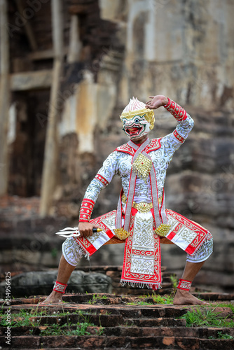 Hanuman-TossakanThai high classical dance in mask. Thai traditional dancing in a nice green, white  color shiny outfit background by historical temple in Lopburi province.