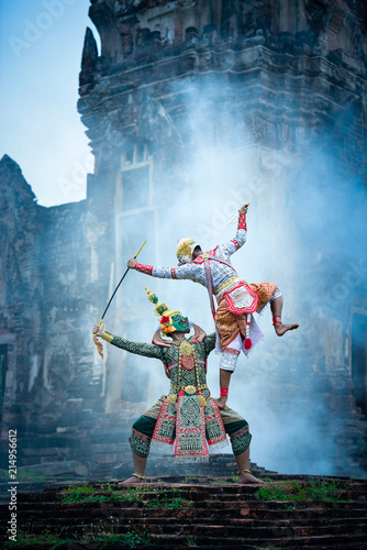 Hanuman-TossakanThai high classical dance in mask. Thai traditional dancing in a nice green, white  color shiny outfit background by historical temple in Lopburi province.