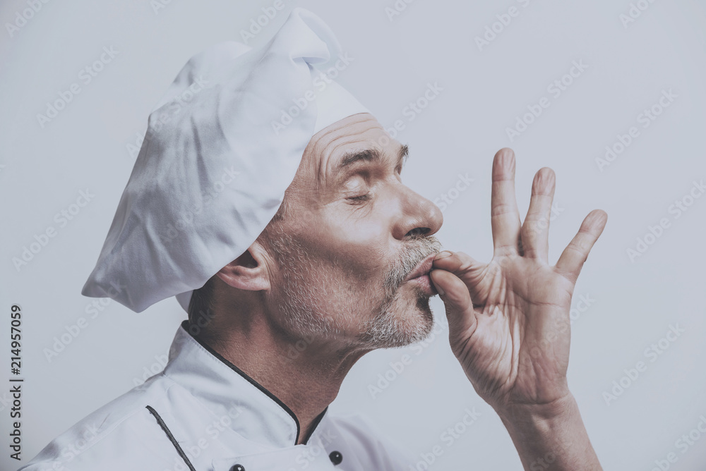 Obraz premium Satisfied Chef Cheeks Fingers.