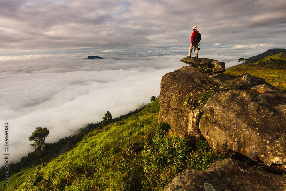 Fototapeta premium Photographer take a photo on high mountain in Phu-Luang, Loei province, Thailand.